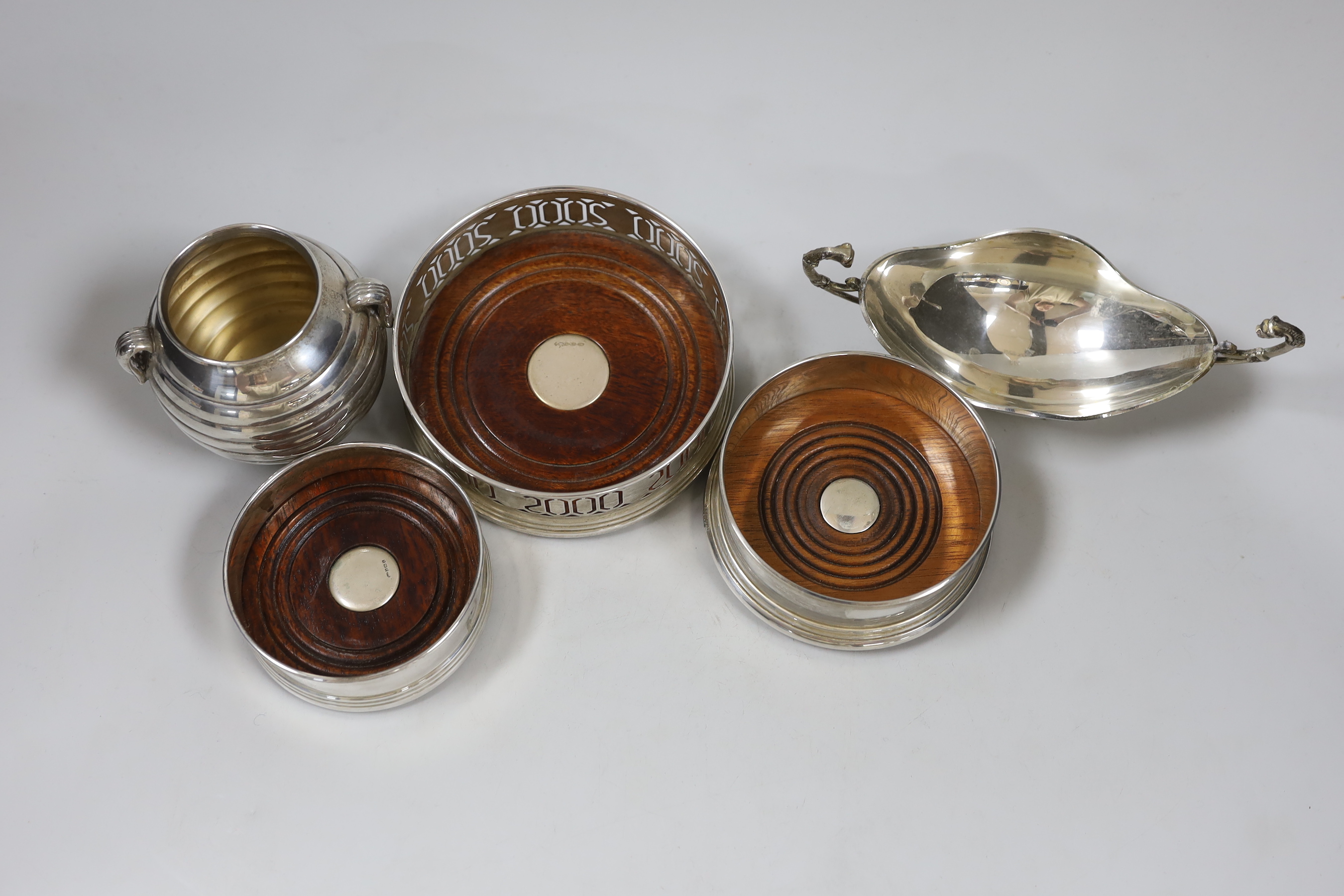 Three modern silver coasters, largest 12.2cm., a modern 925 dish and cup.